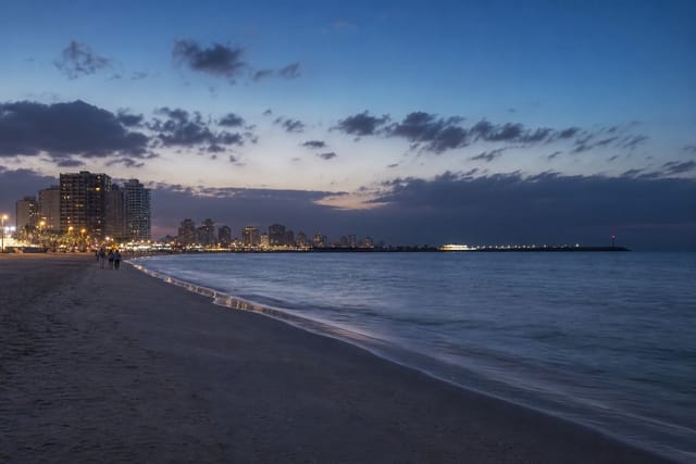 Ajman Corniche at blue hour along a quieter shoreline